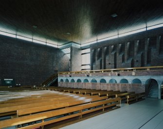Interior. View of light wells and concrete corbel course