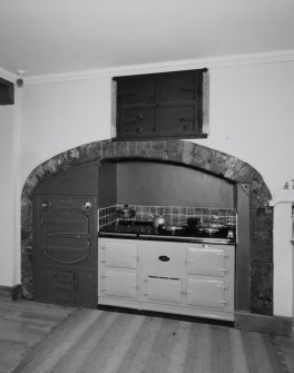 Interior, detail of kitchen fireplace, 19th century oven and 20th century aga