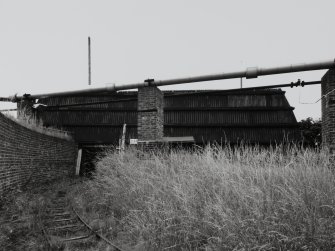 Exterior view from N of mixing house PZ1, (a Nitroglycerine/ Nitrocellulose Mixing House (NS 2885 3984)), showing tramway leading into covered loading bay