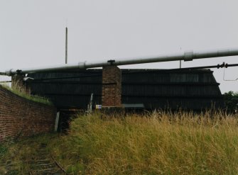 Exterior view from N of mixing house PZ1, (a Nitroglycerine/ Nitrocellulose Mixing House (NS 2885 3984)), showing tramway leading into covered loading bay