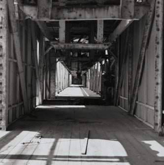 Interior view from SE along centre of ropeway gantry connecting cartridging houses (AZF 1 -4) with non-explosive Mixing House complex (AY1, AY2 and AE1 [NS 2850 3990])