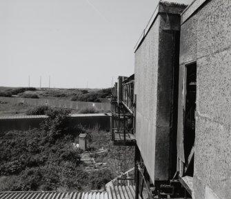 Elevated view from SE along SW side of ropeway gantry connecting Catridging Houses (AZF1 - 4) and non-explosive Mixing House complex (AY1, AY2 and AE1 [NS 2850 3990])