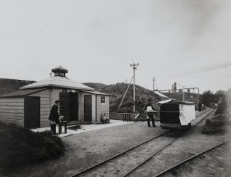 Phtographic copy of view in Blasting Department. Line of Cartridging huts showing bogey and service runners in foreground