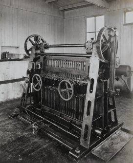 Photographic copy of Interior view.  Blasting Department. Hall Cartridge Machine For Powder Explosives, situated on the upper floor.