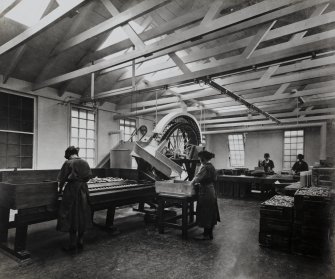 Photographic copy of Interior view of Blasting Department. Packing House for Powder Explosives showing Cartridge dipping machine