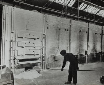 Photographic copy of glass negative showing Interior.  Blasting Departments cleaning out a Kieselguhr Kiln  (2566w)