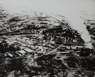 Photographic copy of oblique aerial view of factory from SW.