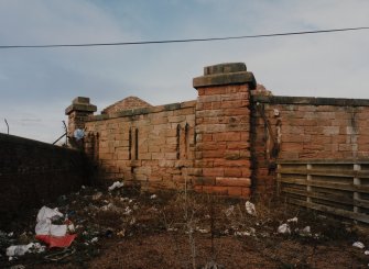 View of walls forming SW corner from E