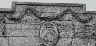 Detail of carved panel on parapet of W block.