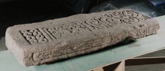 Oblique view of Carved sandstone lintel, from Great Cumbrae Island, Mid Kirkton.