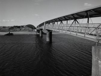 Oblique view from S along SW side of the bridge, with 'The Bid Idea' visible in the background