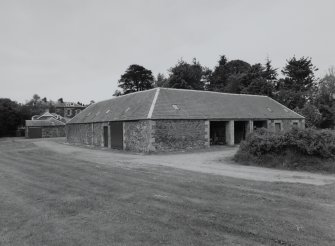 View of steading from North North East showing three bay cart house and Inchyra House beyond