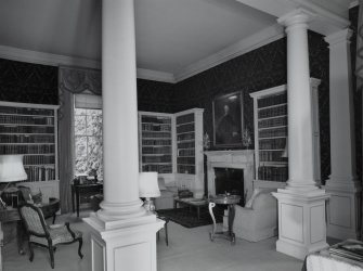 Interior. View of ground floor library from SE through columned screen