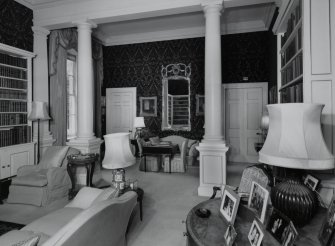 Interior. View of ground floor library from W showing columned screen