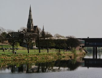 Distant view from NW showing relationship to shopping centre and river