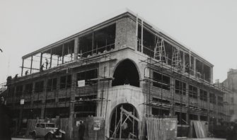 Copy of historic photograph showing view from NW during construction.
