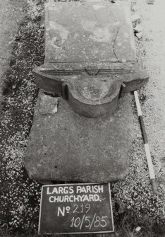 View of collapsed headstone with semi-circular central feature.  Inscription Illegible.
Largs Parish Churchyard no 219

