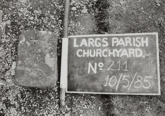 Detail of lair marker. 
Insc: "J.M"
Largs Parish Churchyard No 211


