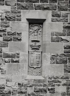 Detail of carved panel to W of main doorway.