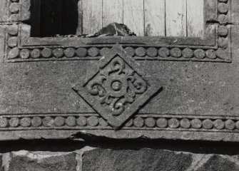 Detail of decorative carving on cill of doorway