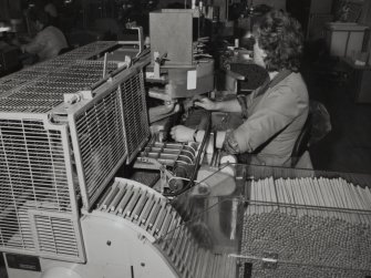 368 Alexandra Parade, WD & HO Wills Tobacco Factory, interior
View of left-handed cigar over-rolling machine, secondary production area, cigars, first floor