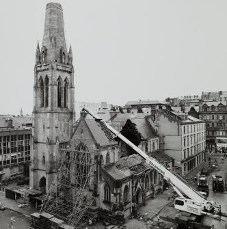 High level view of damaged roof and spire from SE