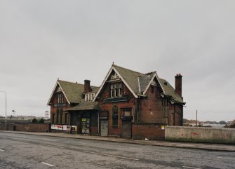 General view of station offices from NE, with Balmore Road in the foreground