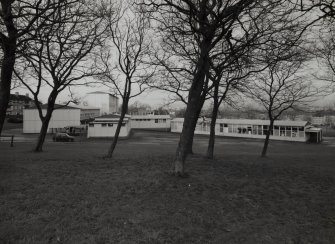 Distant view of school from South showing setting