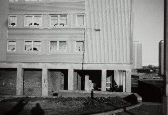 Glasgow, Coll Street Development.
Detail from South of specimen block with Petershill Drive high-rise flats in the background.