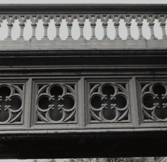 Detail of portion of cast-iron cladding on side of bridge beneath parapet (at deck level)