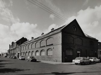 General view from SE of SE corner of works, showing elevations onto Dora Street (right) and French Street (left)