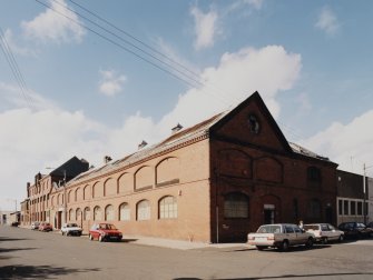 General view from SE of SE corner of works, showing elevations onto Dora Street (right) and French Street (left)