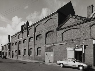 Exterior view of central portion of works from SE, fronting onto French Street