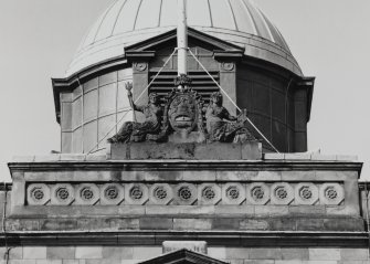 Detail of carved figures and coat of arms above central bay on south front