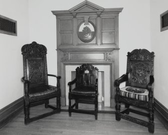 Interior, ground floor, reception room, view of fireplace and oak chairs