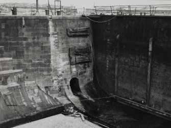 Glasgow, 18 Clydebrae Street, Govan Graving Docks.
General view of no.1 graving dock from West, with outlet from filling culvert.
