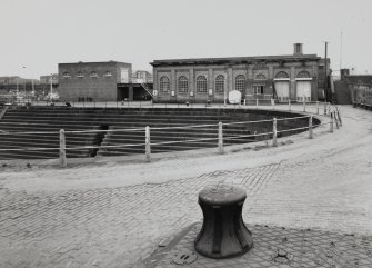 Glasgow, 18 Clydebrae Street, Govan Graving Docks.
General view from N-N-E at North-West end of no.2 graving dock with main compressor house, substation, powered capstan.