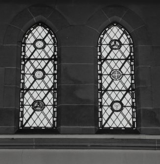 Interior. 
Detail of stained glass in the aisle at ground level.