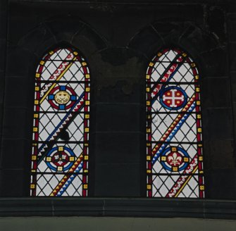 Interior. 
Detail of stained glass in the aisle at ground level.