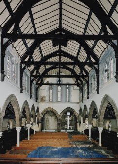 Interior. 
General view of upper level from W showing the inserted floor, the arcade and the roof structure.