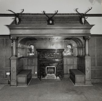 Glasgow, 52 Langside Drive, interior.
General view of ground floor reception room ingle-nook fireplace with stag's heads above.