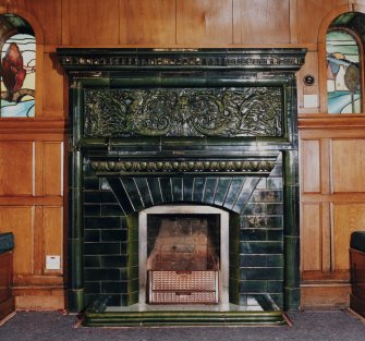 Glasgow, 52 Langside Drive, interior.
General view of the ground floor reception room fireplace. Dark green tiled design of a Green Man and two winged sea-horses.
