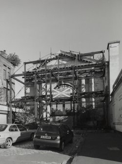 View of gate under scaffolding from S