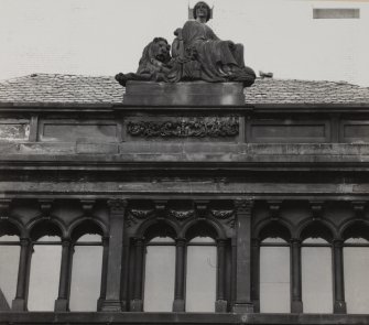 Detail of axial feature at parapet level of W wall of Courtyard.
