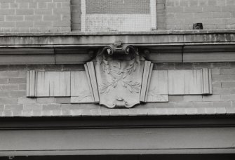 Janitor's house, carved cartouche style panel, detail