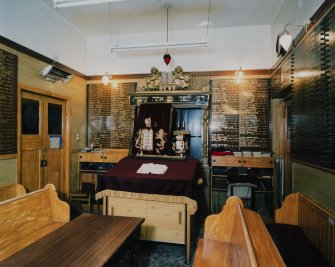 Interior. 'Mini' Synagogue in W corner. Parokhet curtain open