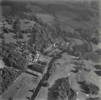 Glasgow, Pollok House.
Oblique aerial view from West showing house, gateway, dovecot and castles.