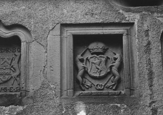 Detail of heraldic panel over entrance.