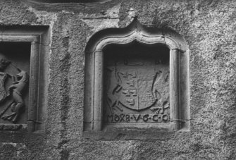 Detail of heraldic panel over entrance.