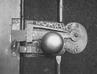 Detail of spring latch on session house door.